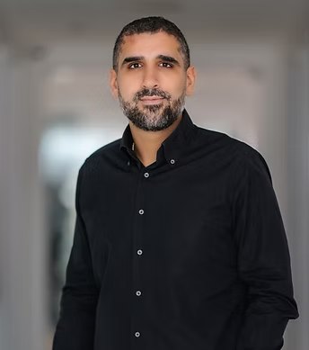 Dr J. Assayag